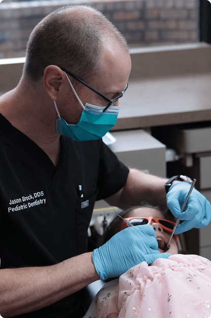Dr. Jason Brock treating a young patient at Big Picture Pediatric Dentistry